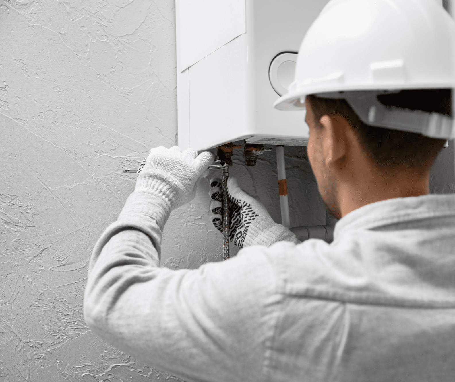 worker-repairing-water-heater Fresno CA Heating repair